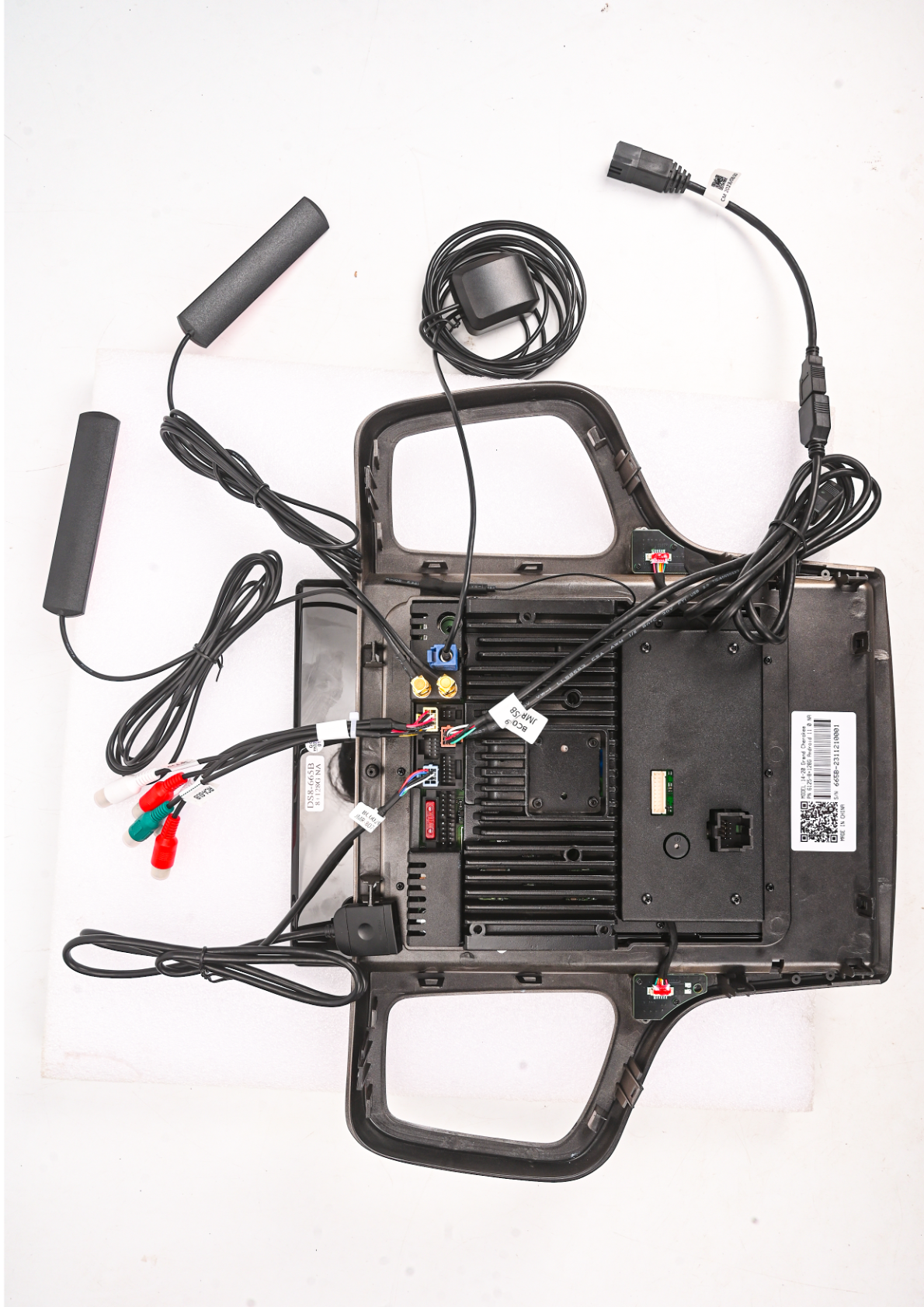 Jeep Grand Cherokee - Photo showing the backside of an aftermarket head unit with various connectors and wiring.