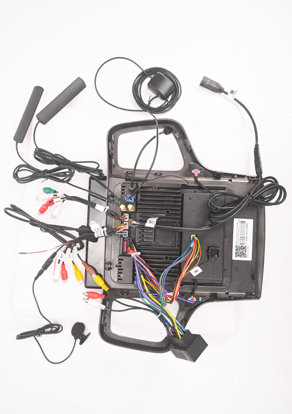 Jeep Grand Cherokee - Photo showing the aftermarket head unit with various wiring connections and components.